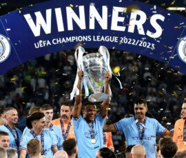 Manuel Akanji lifts the Premier League trophy